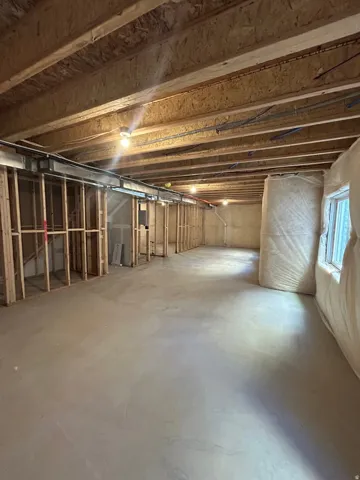 Unfinished basement providing expansive open space