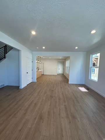 Spacious interior featuring wood-finish flooring throughout