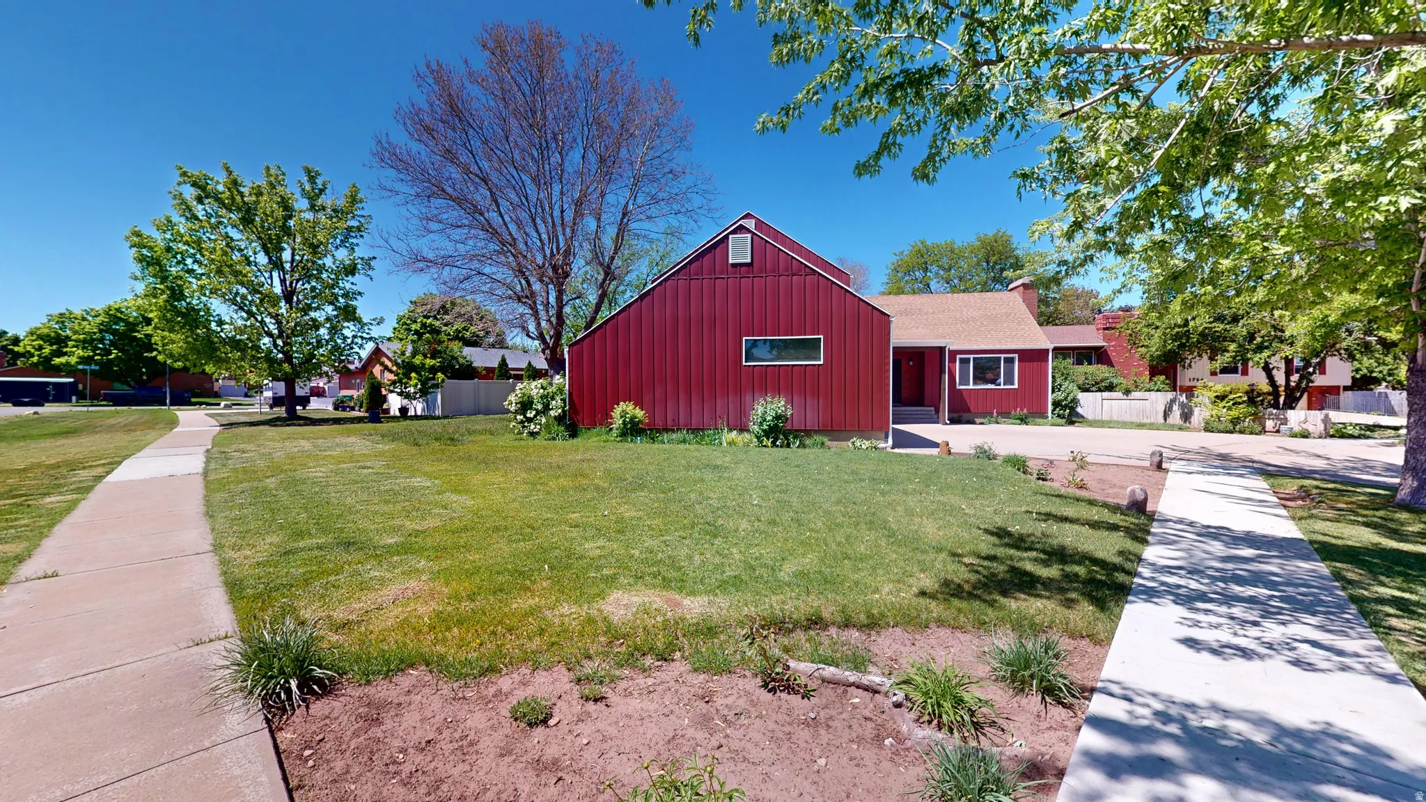 Red siding exterior with a contrasting lighter roofline