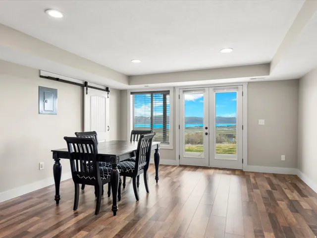 Interior space with wood-finish flooring, recessed lighting, and light-toned walls