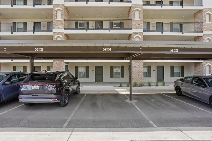 Covered parking structure with individual marked spaces