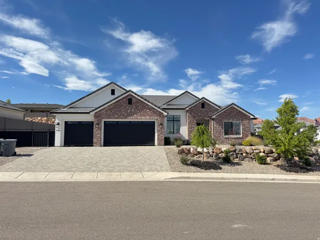 Contemporary exterior featuring brick and stucco finishes