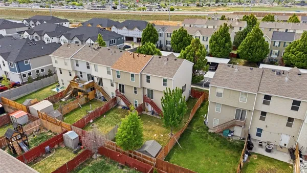 Townhome development featuring multiple units with individual fenced yards