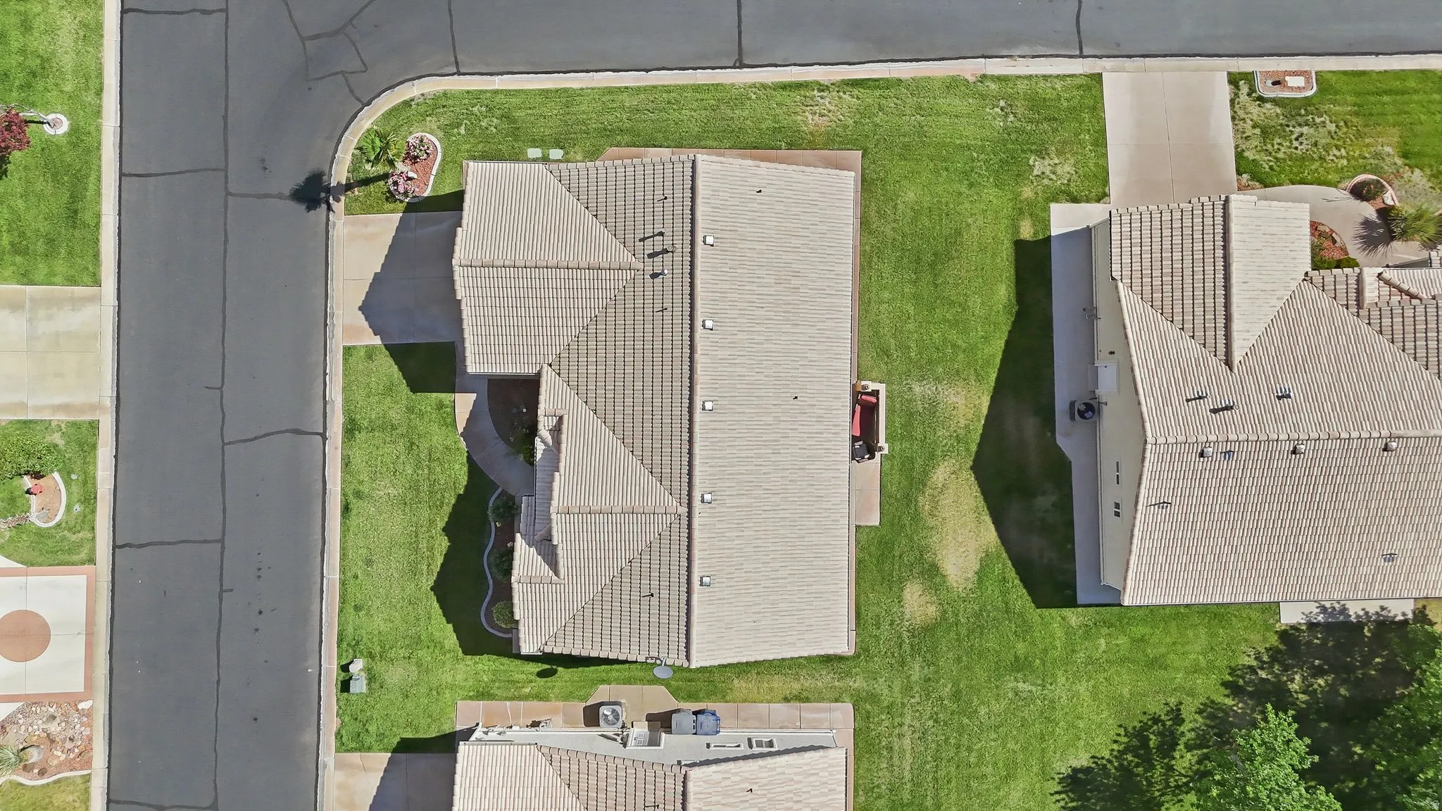 Aerial perspective showcasing a property with extensive surrounding green space