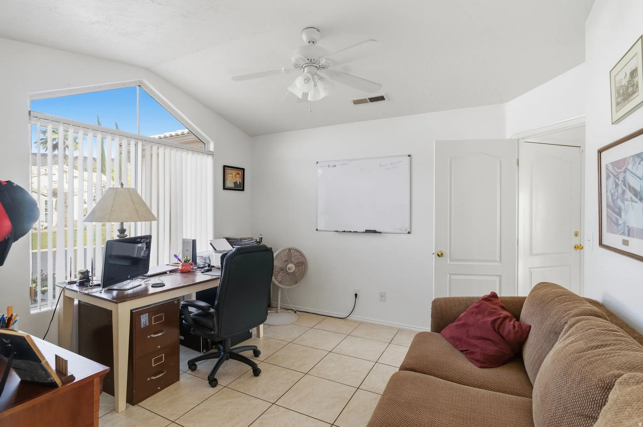 Room featuring vaulted ceilings and ceramic tile flooring