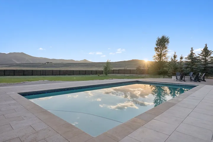 Rectangular in-ground swimming pool with a blue tiled edge