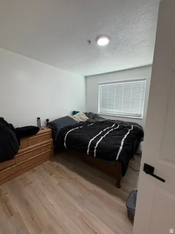 White walls with wood-finish flooring