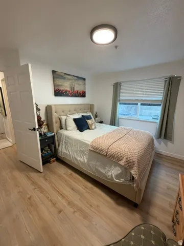 Light wood-finish flooring complements the neutral wall tones