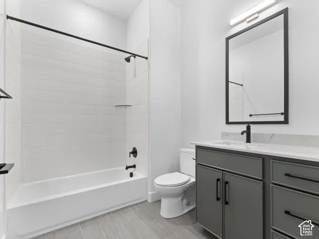 White subway tile shower surround with black fixtures