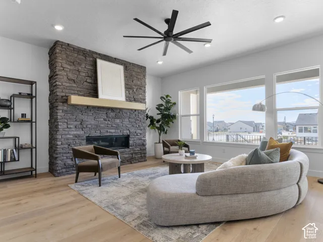 Stone-clad fireplace with a wood mantel