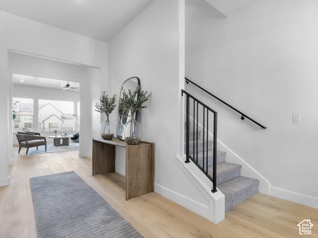 Light wood-finish flooring with crisp white walls