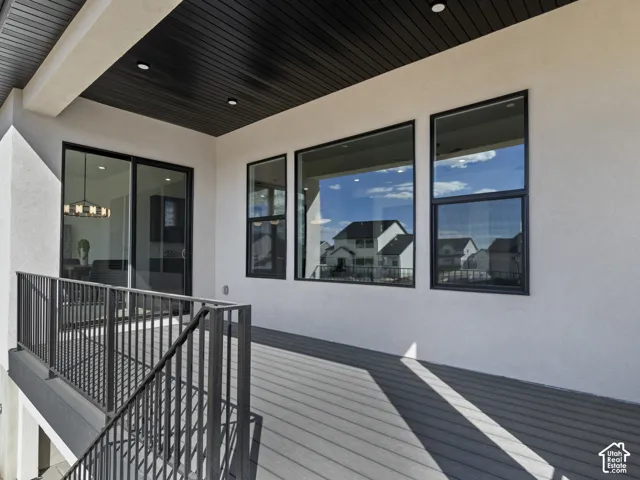 Outdoor deck with composite decking and black metal railings