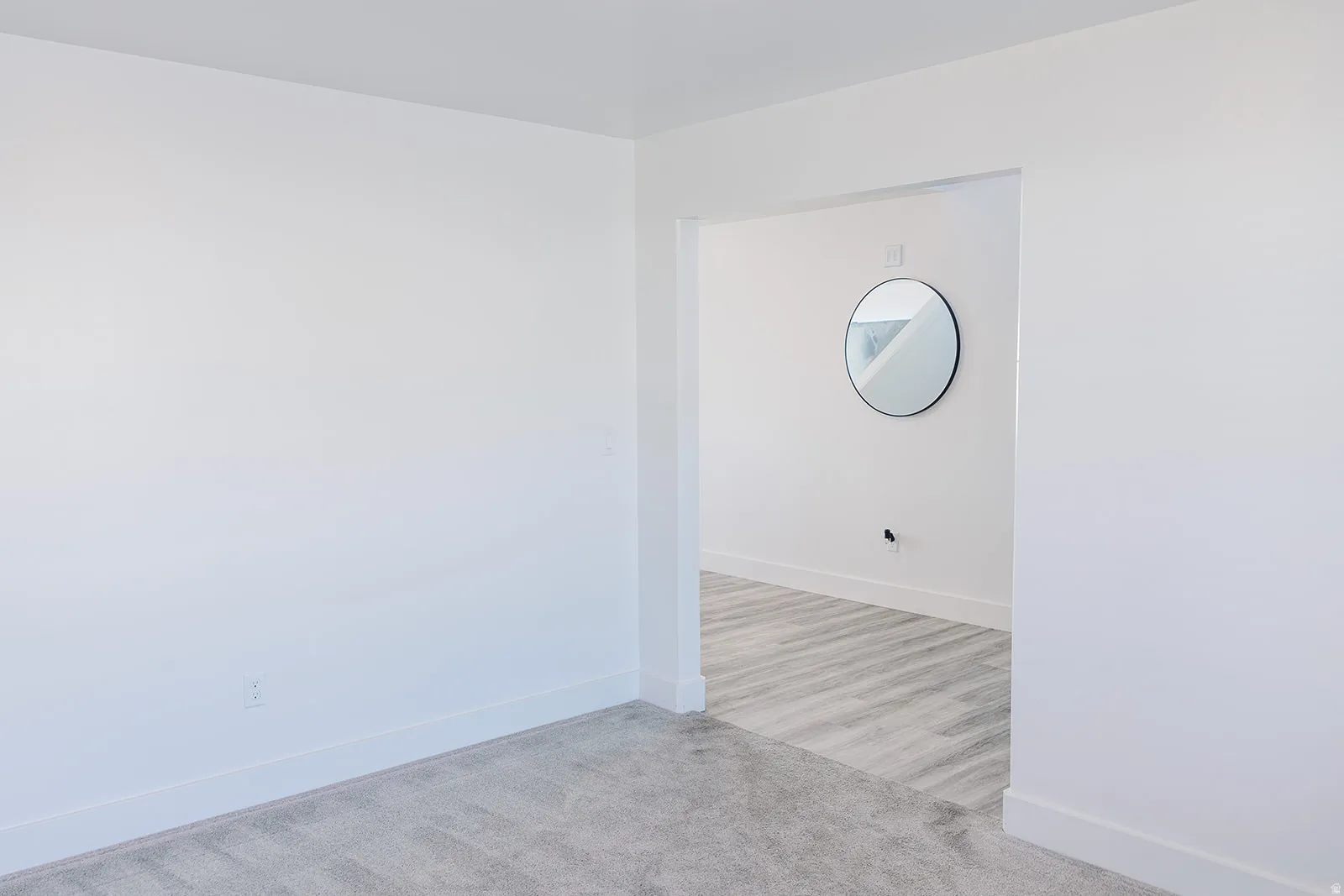 Bright interior space featuring a wide entryway and neutral color palette