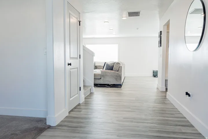 Open interior space featuring wood-finish flooring, white walls, and recessed lighting