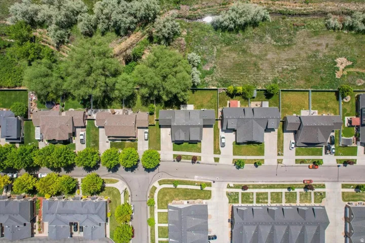 Aerial perspective showcasing residential properties with established landscaping