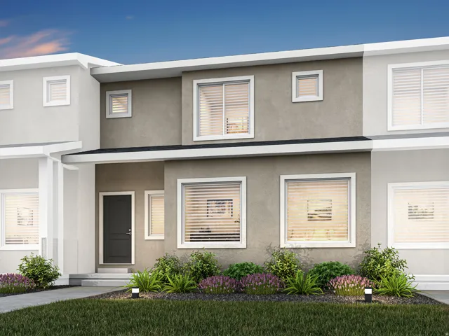 Contemporary multi-level facade featuring varied stucco finishes and crisp white trim