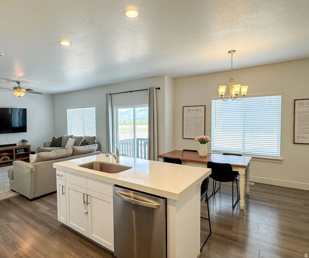Open-concept living space with wood-finish flooring
