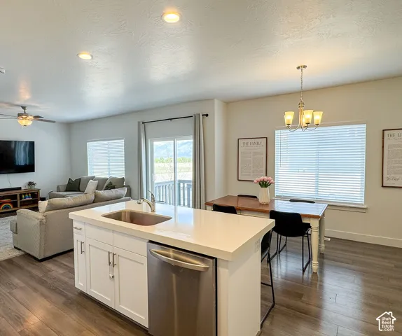 Open-concept living space with wood-finish flooring