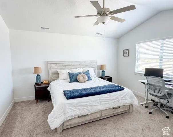 Bedroom featuring vaulted ceilings, a ceiling fan, carpeted flooring, a window with blinds, and white baseboards