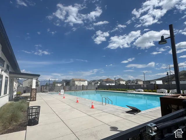 Outdoor swimming pool with concrete decking