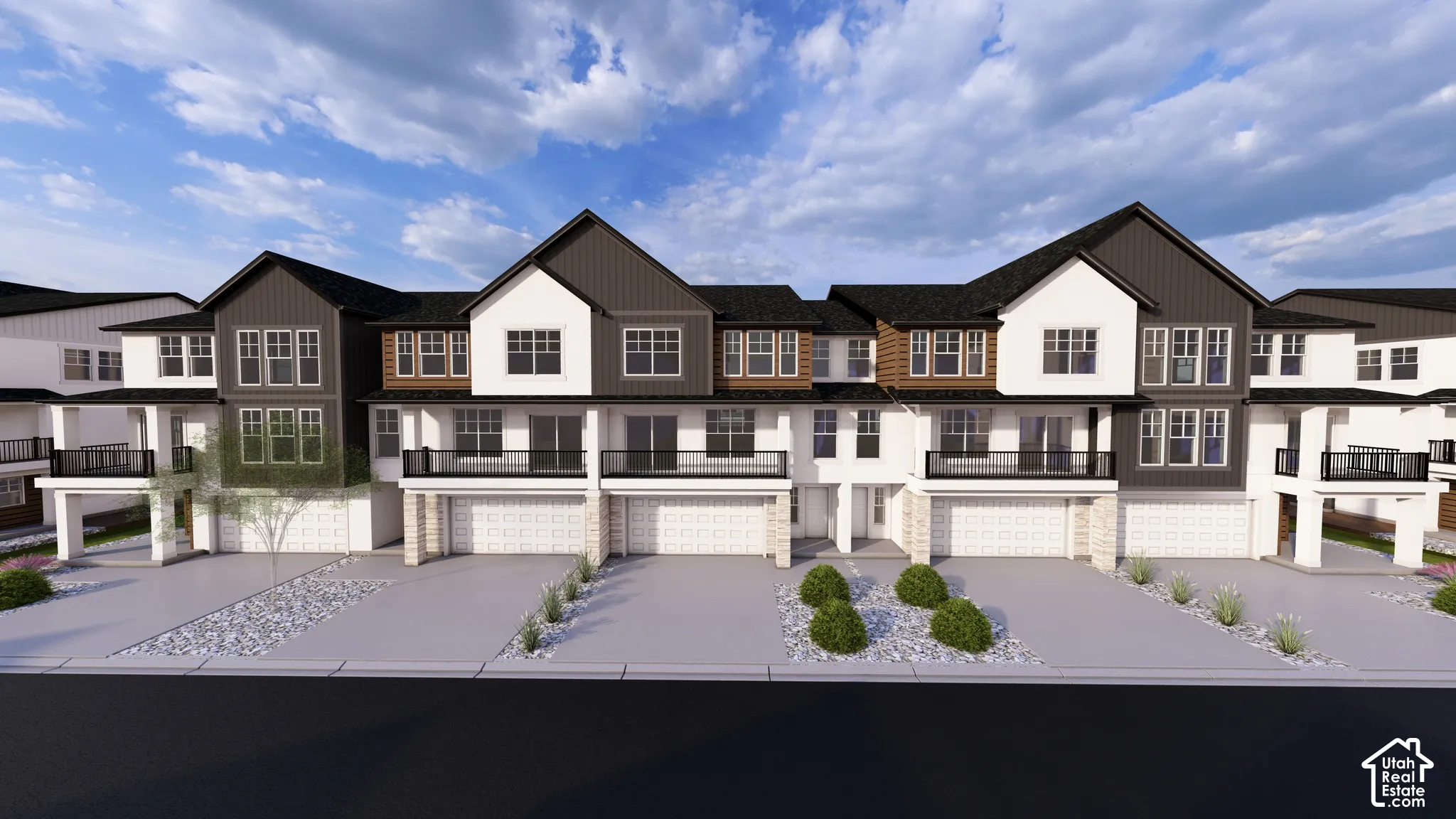 Contemporary townhome exteriors featuring multi-toned siding, black frame windows, and private balconies with black railings