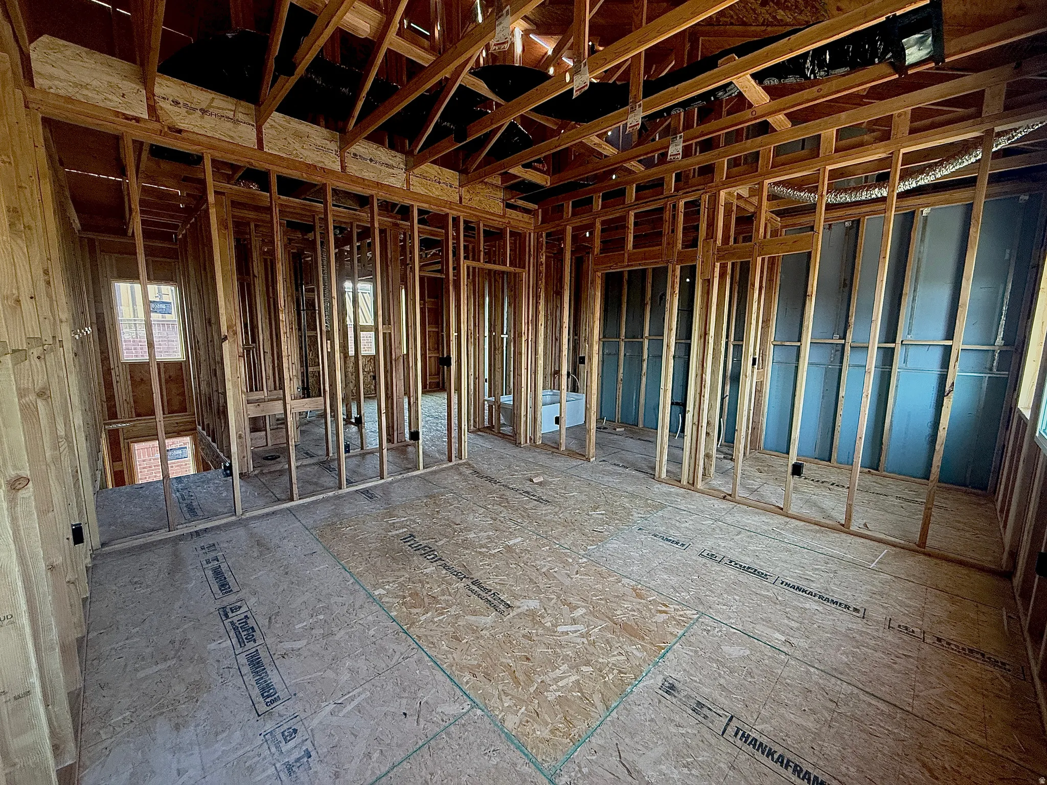 New construction framing showcasing open floorplan design