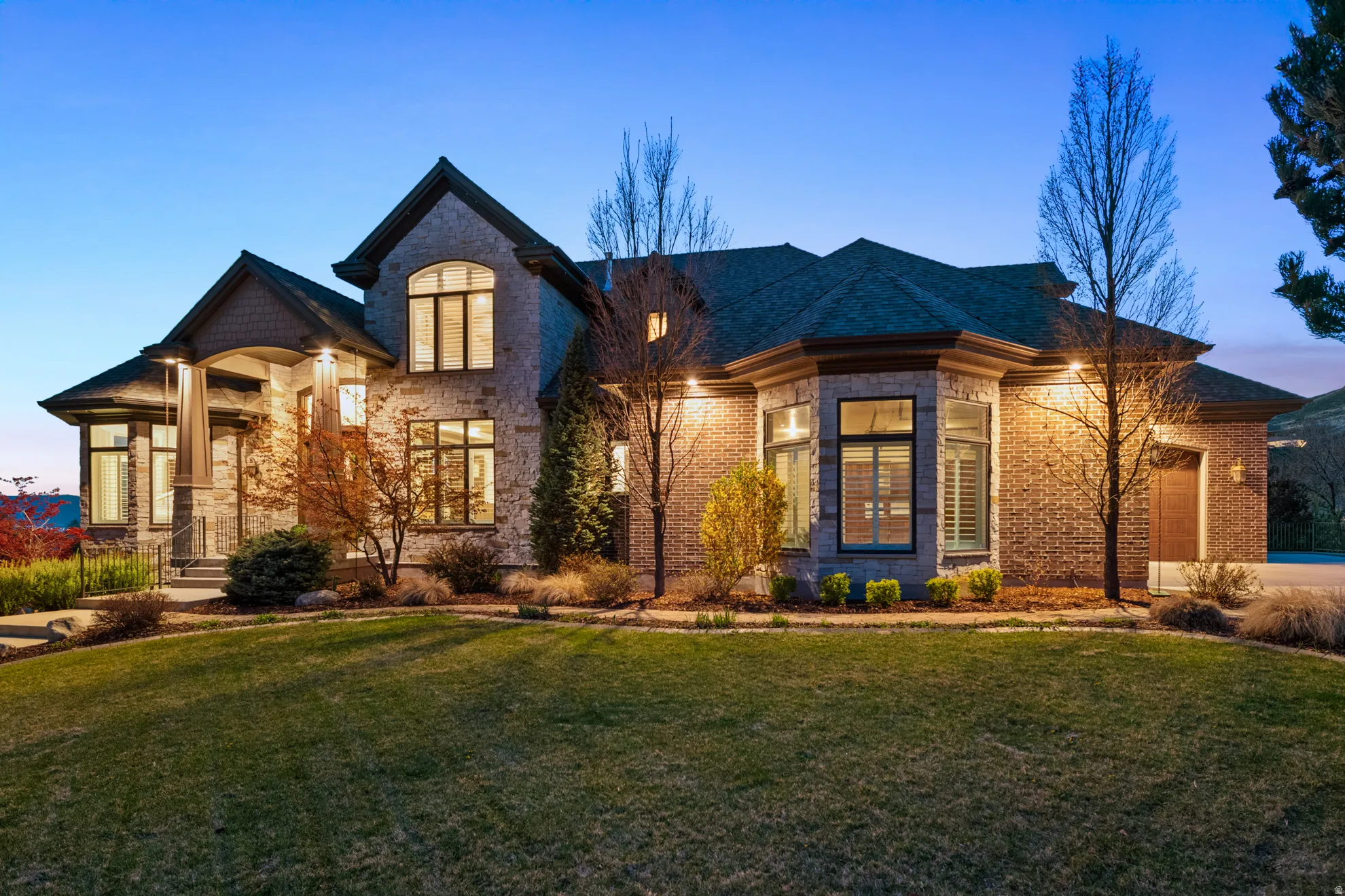 Stone and brick exterior with a multi-gabled roofline