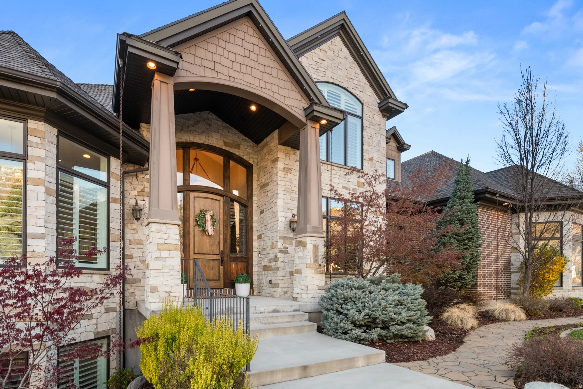 Stone and brick façade with gabled roof lines