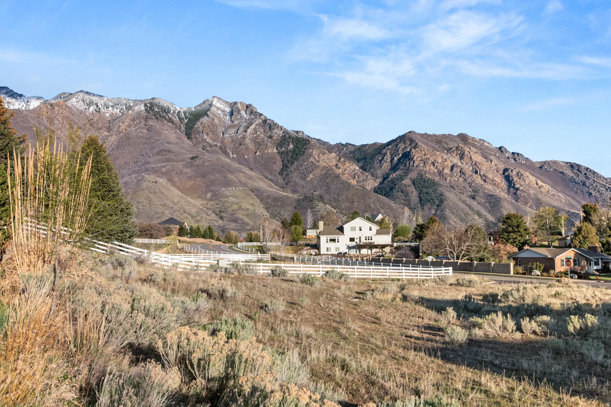 Expansive mountain landscape with snow-capped peaks