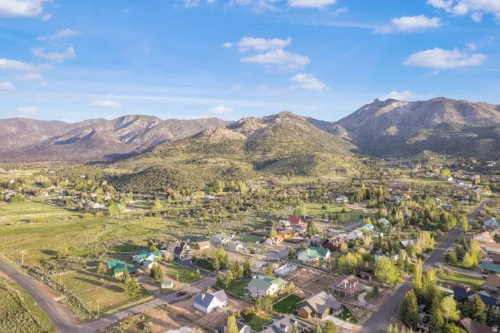 Expansive residential area featuring established homes, mature trees, and varied terrain