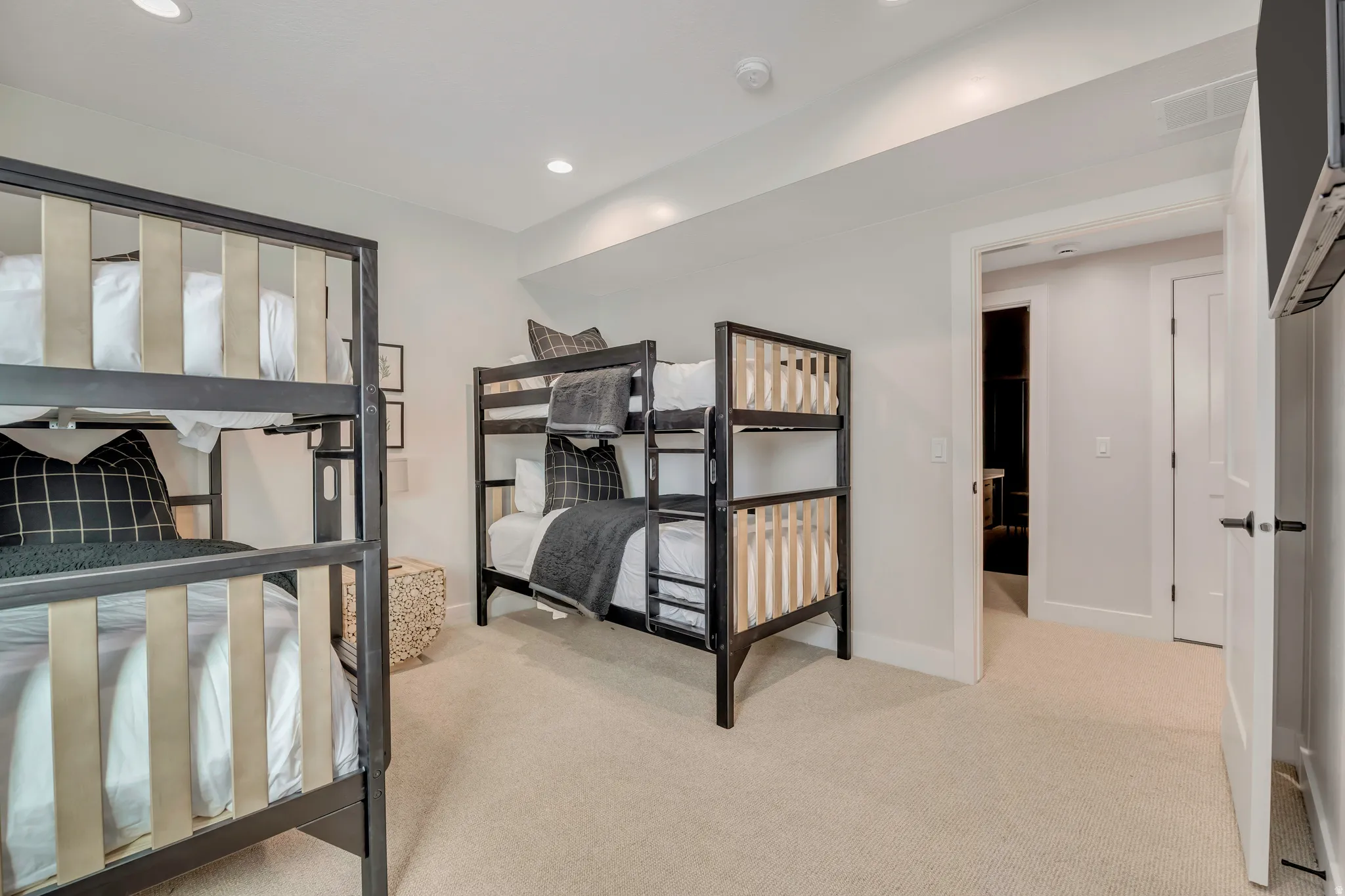 Bedroom with light carpet and recessed lighting