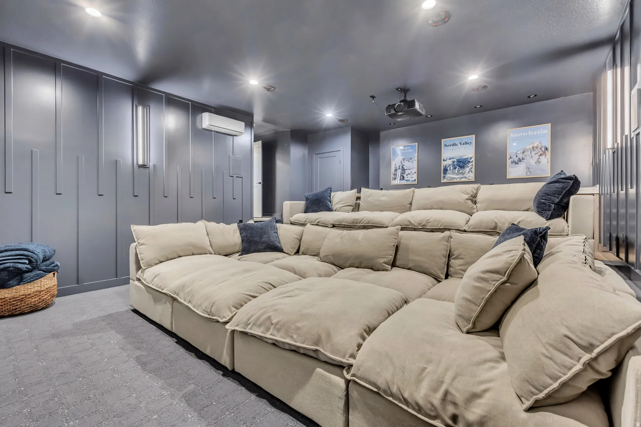 Home theater with recessed lighting, a wall mounted mini split, and light colored carpet