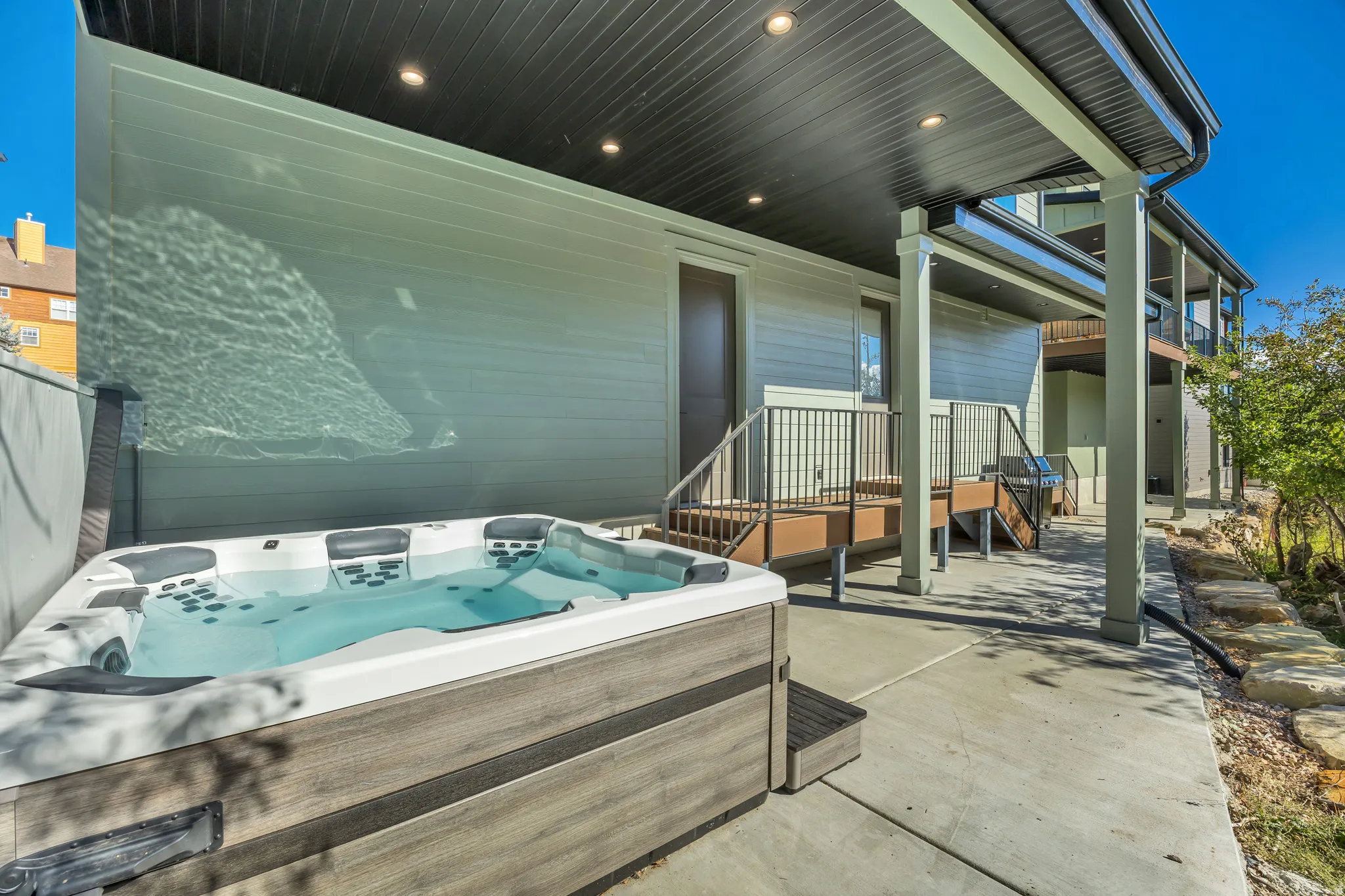 View of patio featuring a hot tub