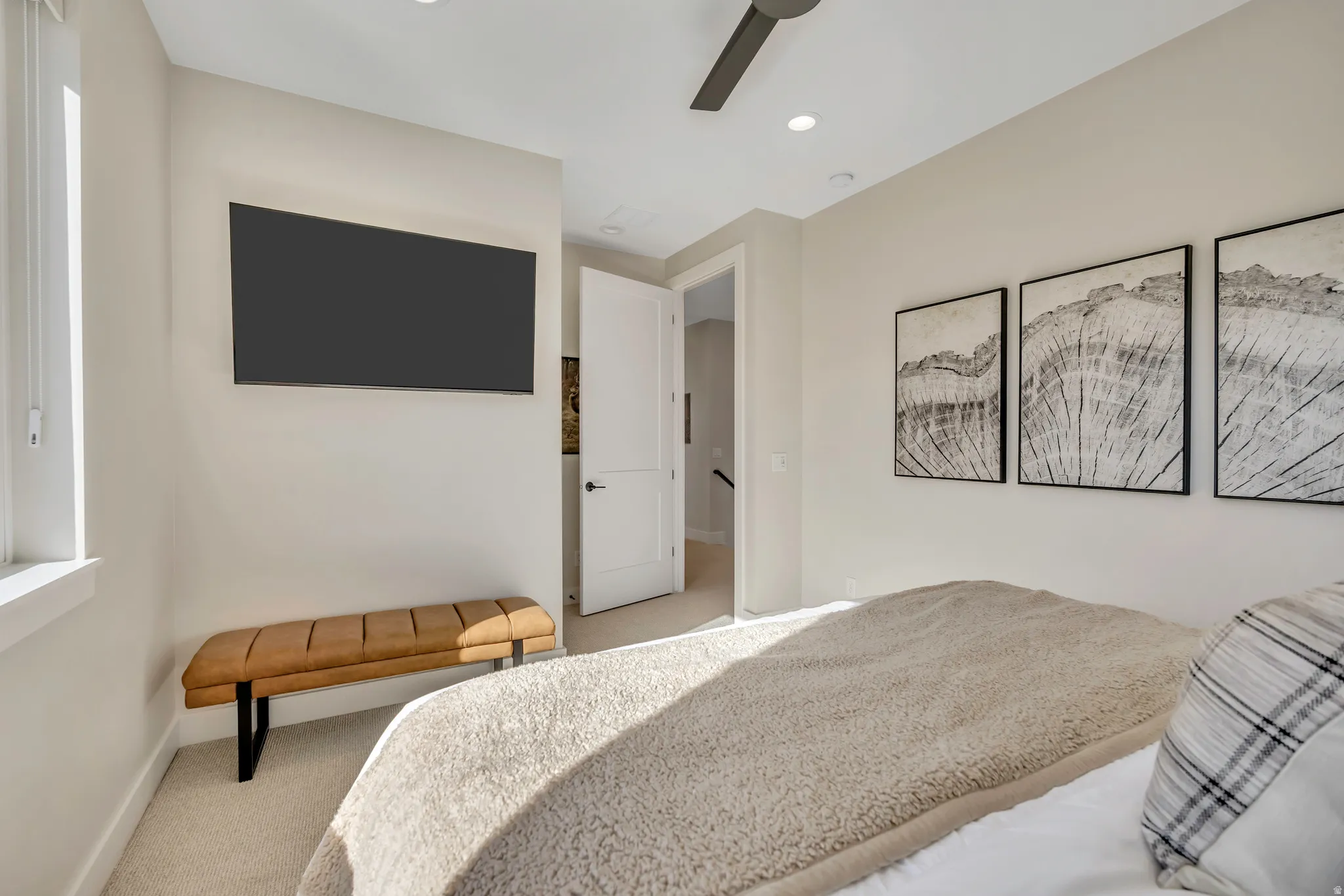 Bedroom with light carpet, a ceiling fan, and recessed lighting