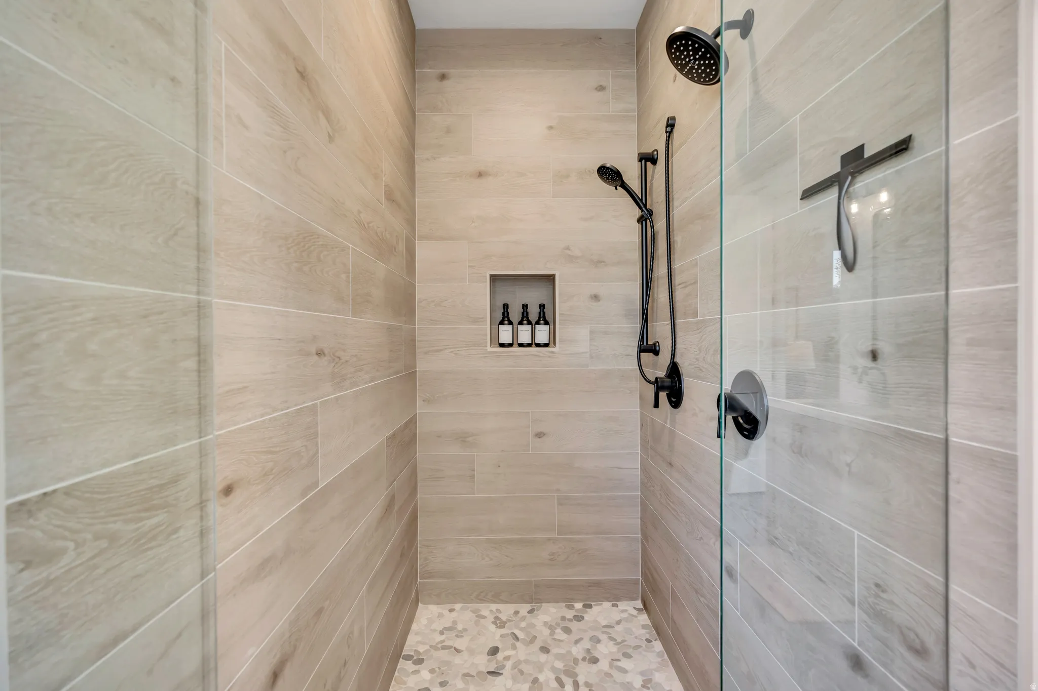 Full bathroom featuring a stall shower