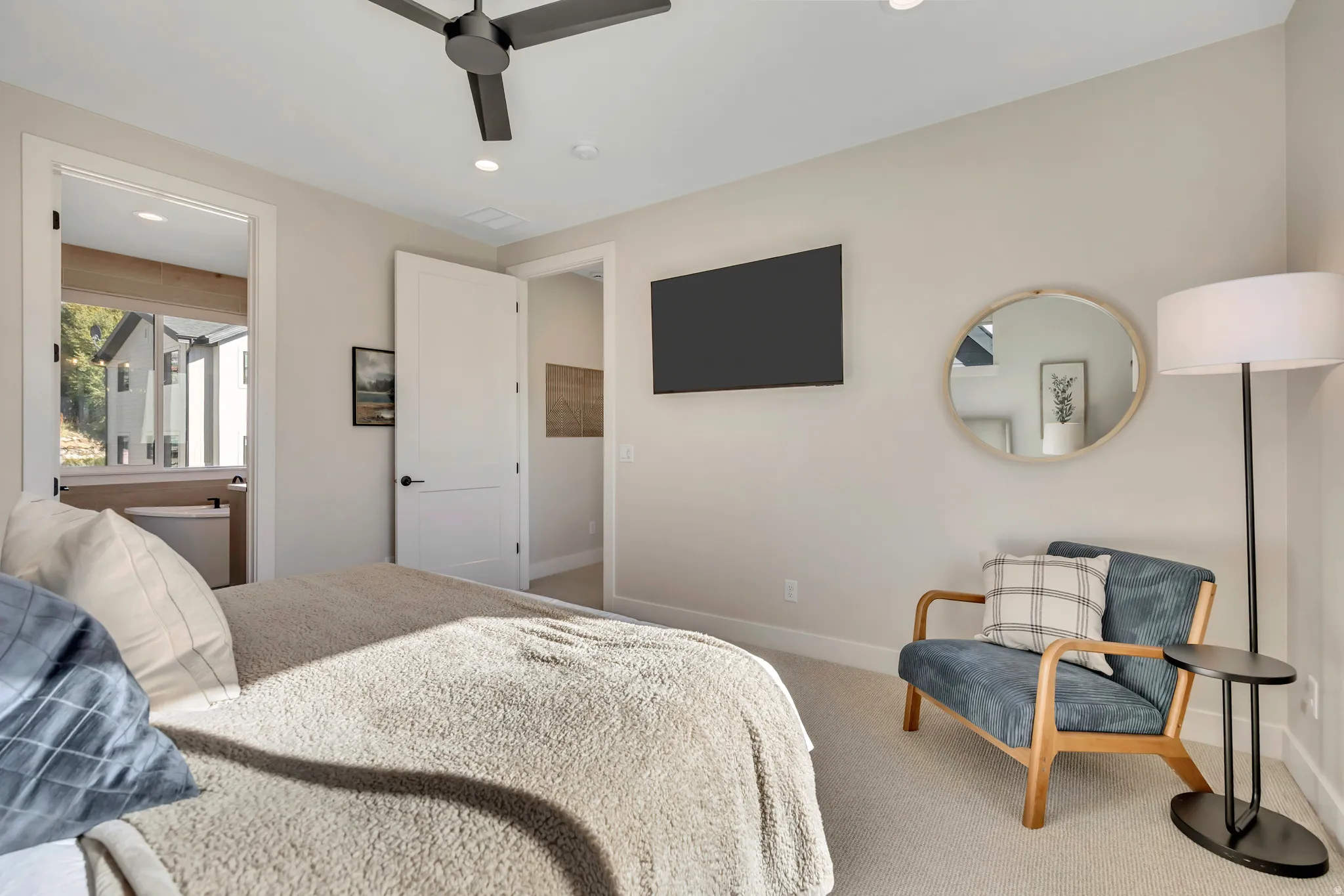 Carpeted bedroom with recessed lighting and ceiling fan