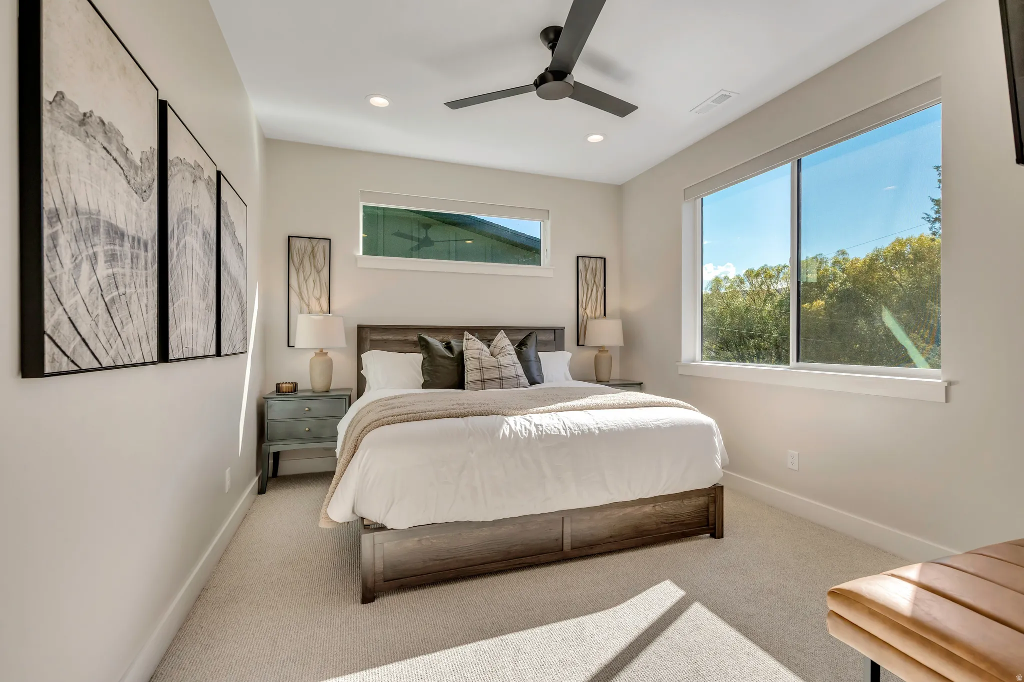Carpeted bedroom with ceiling fan and recessed lighting