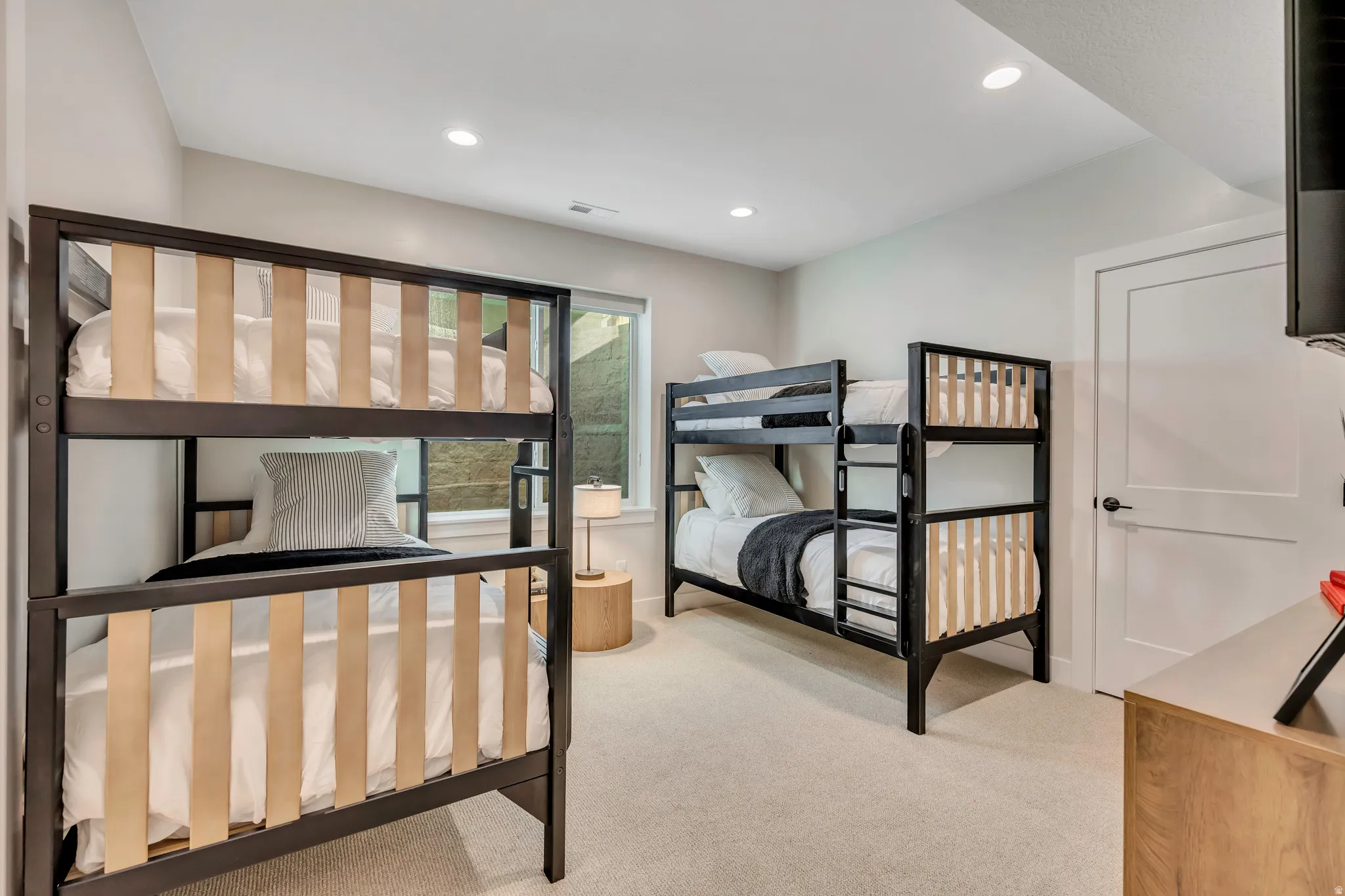 Bedroom featuring light colored carpet and recessed lighting