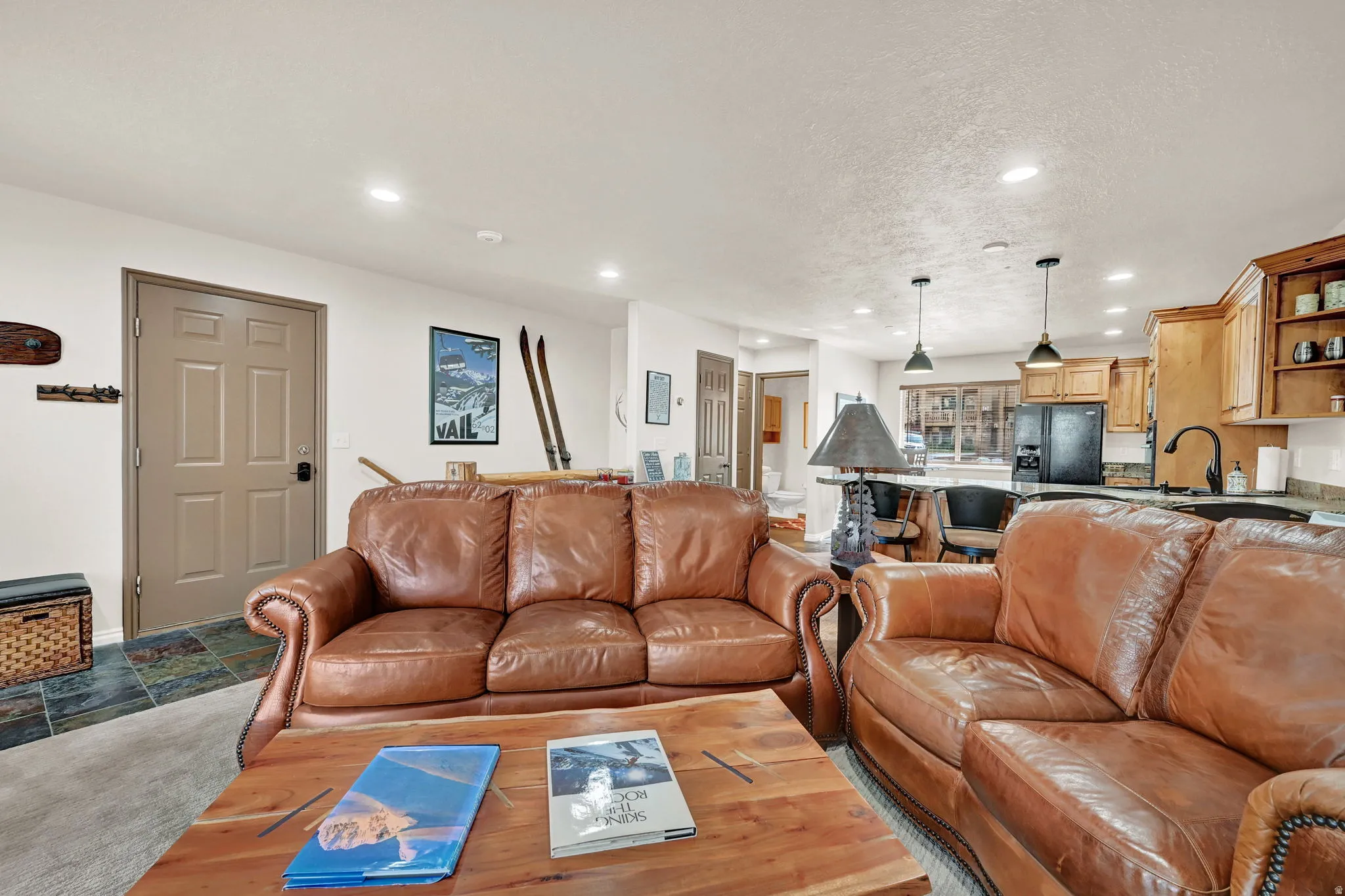 Open-concept living space featuring recessed lighting and wood-finish flooring