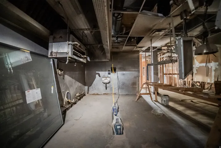 Unfinished below grade area with a heating unit