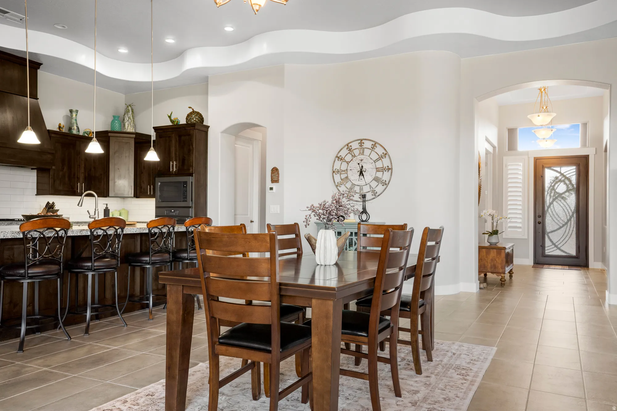 Open concept dining area featuring a wood-finish dining table and chairs