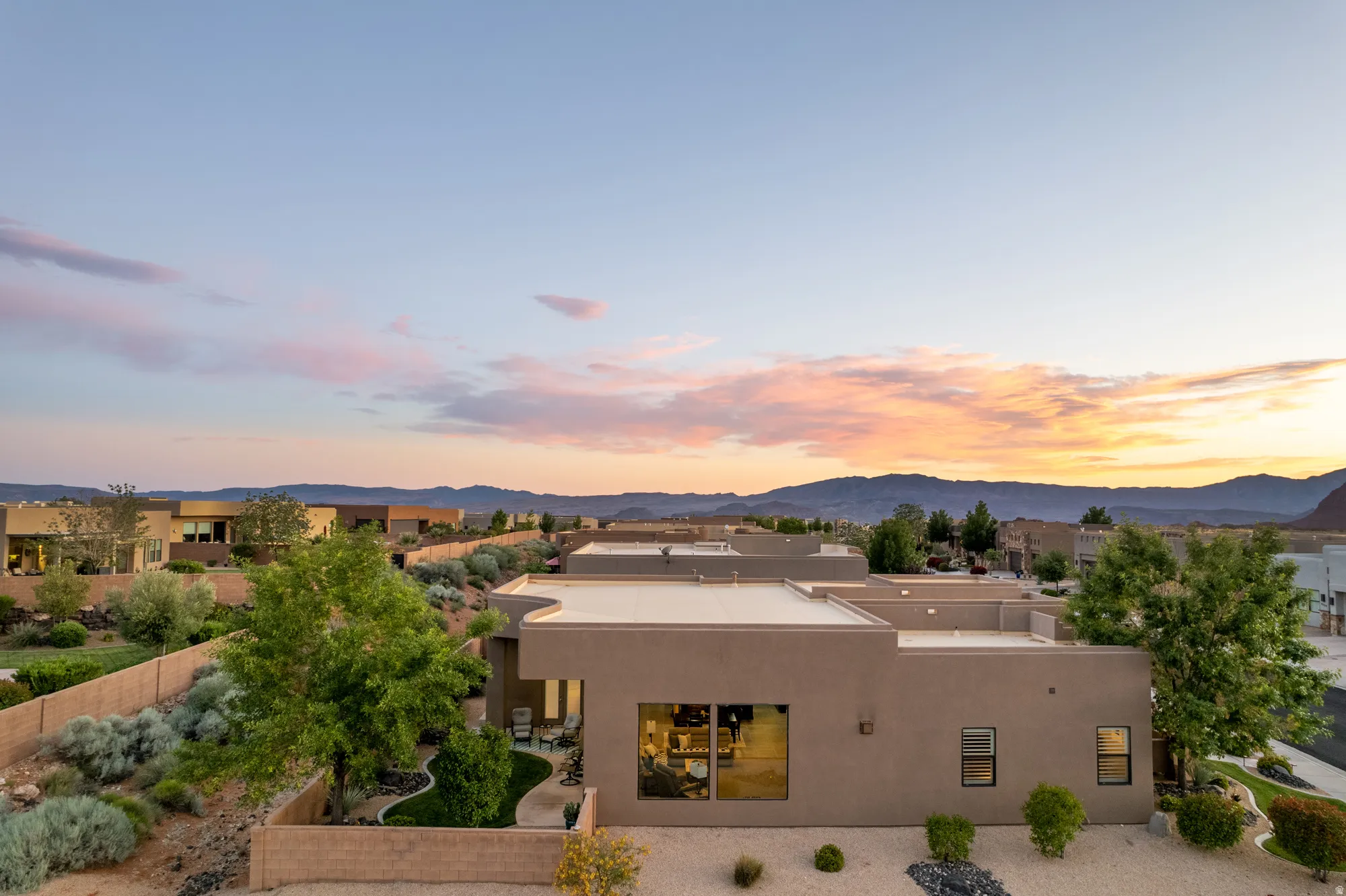 Southwestern-style architecture featuring a stucco exterior and flat roofline