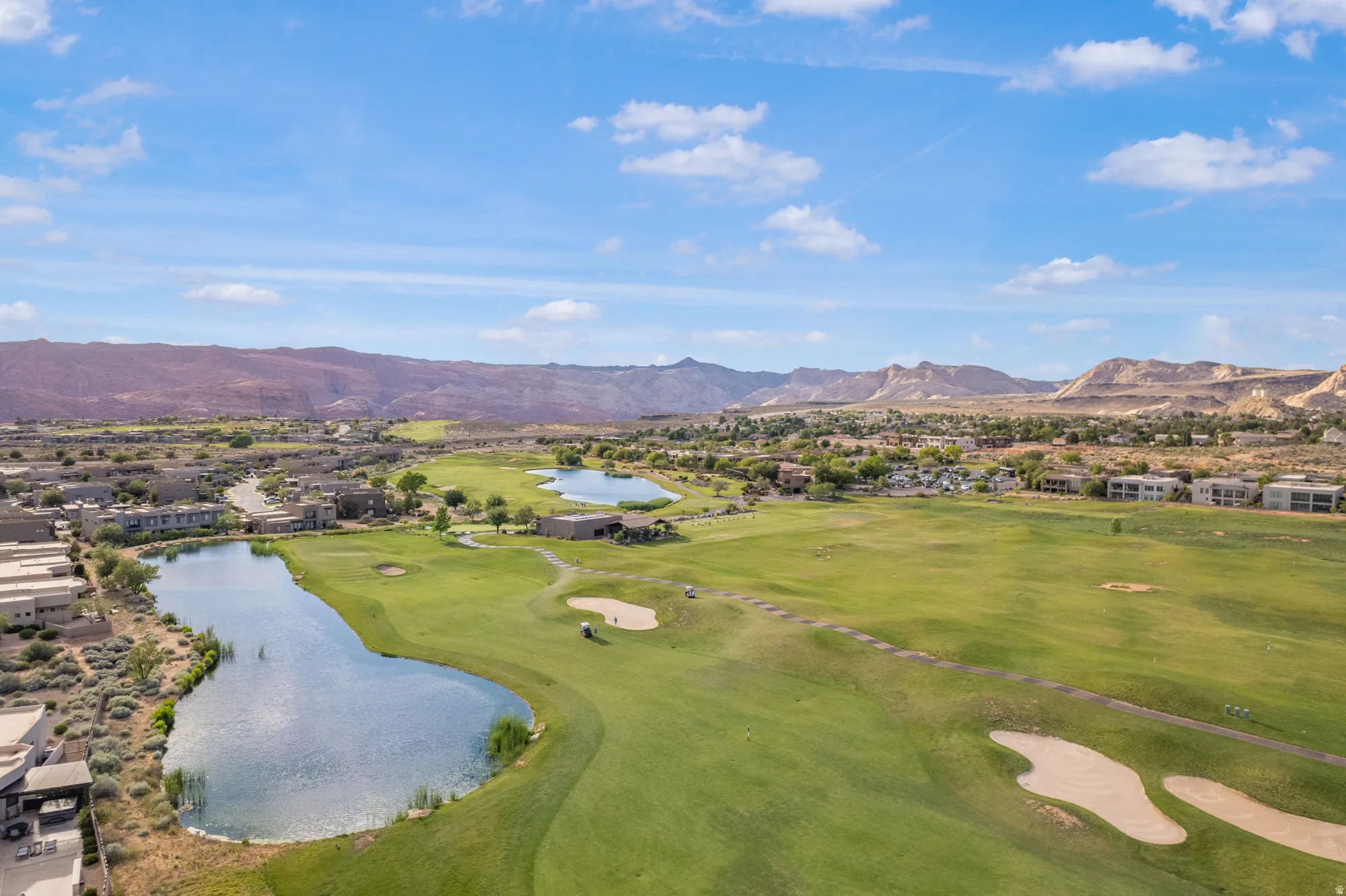 Expansive golf course with multiple greens and sand traps
