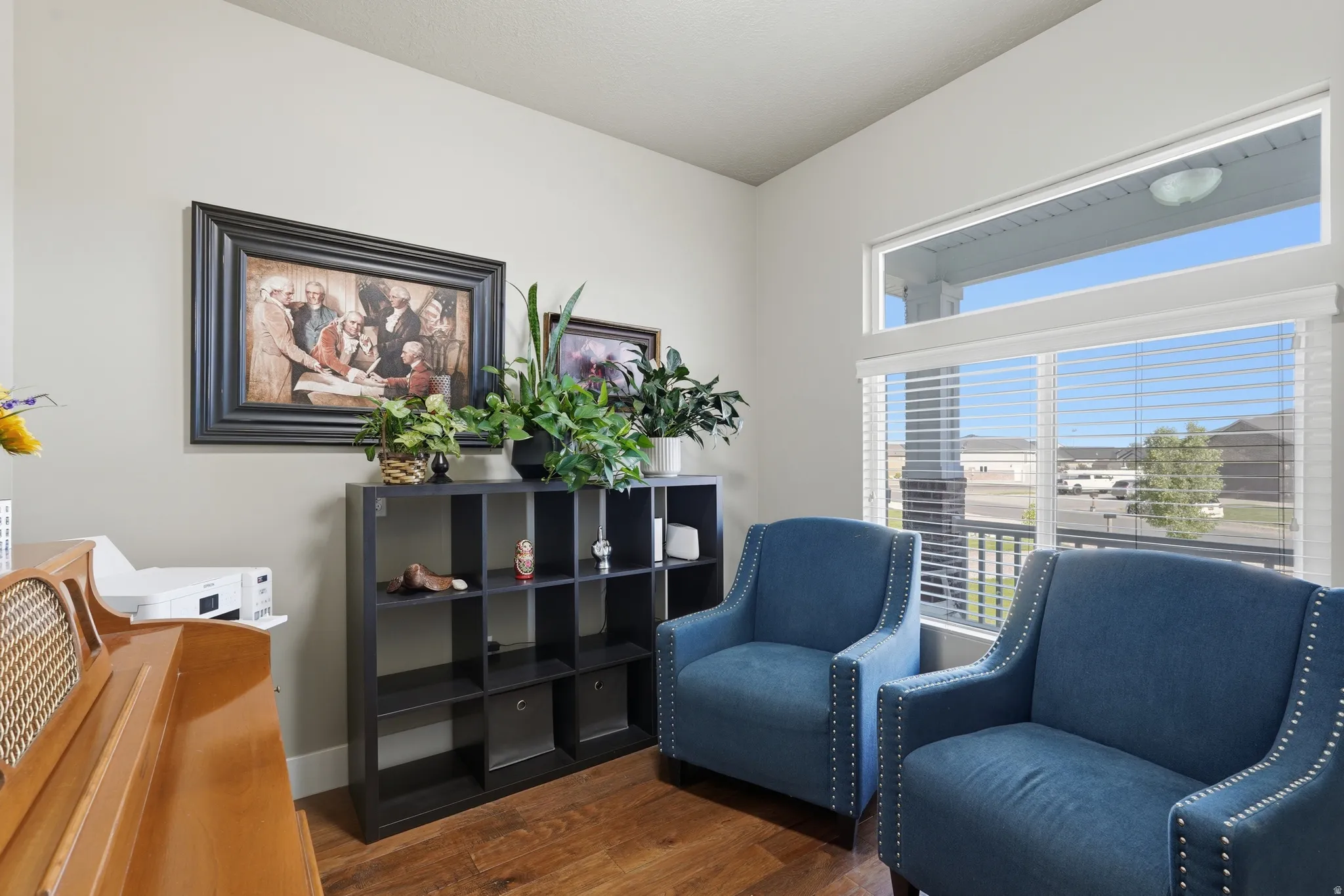 Room featuring wood-finish flooring and light-toned walls