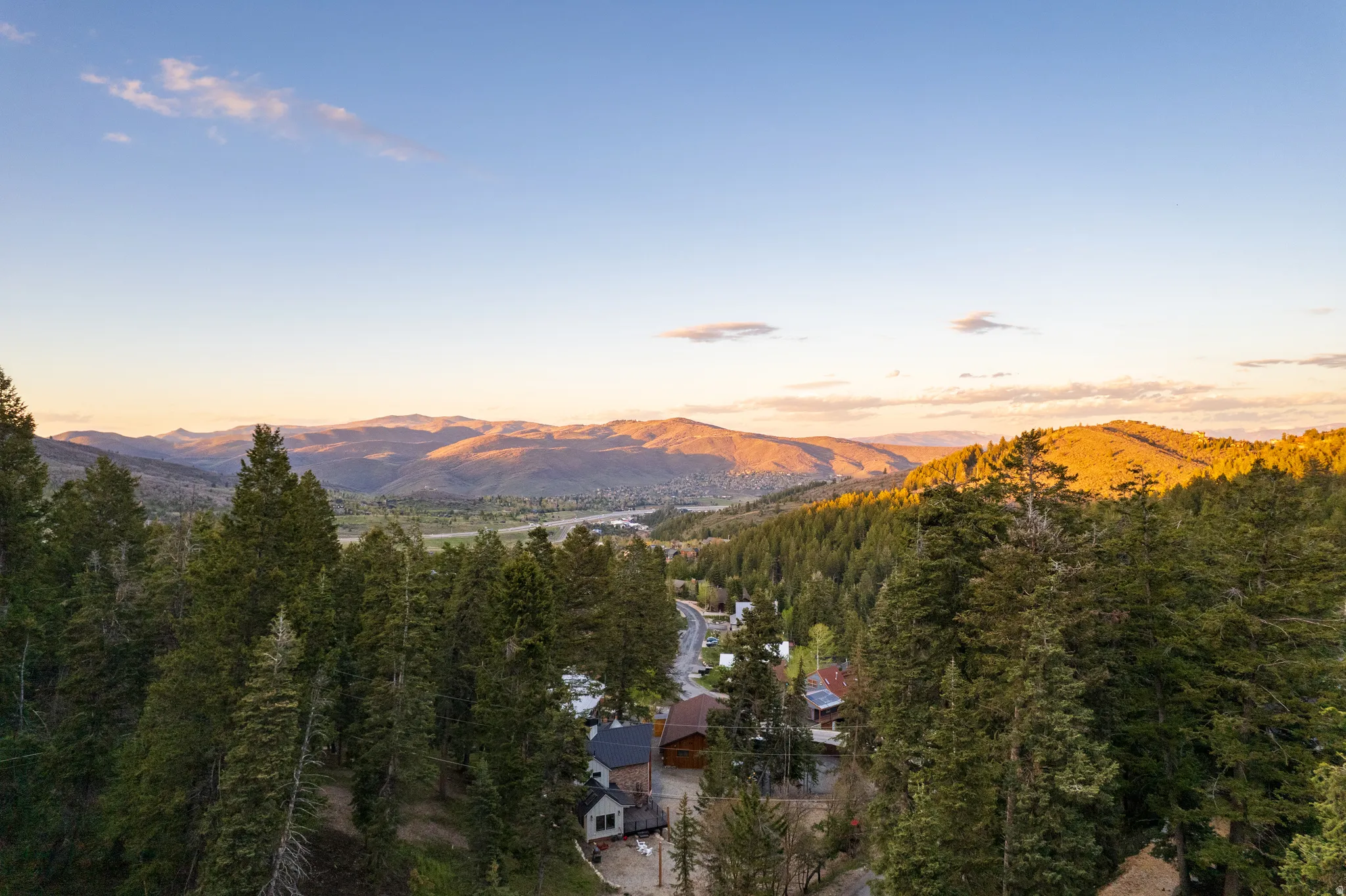 Expansive mountainous terrain with dense evergreen forests
