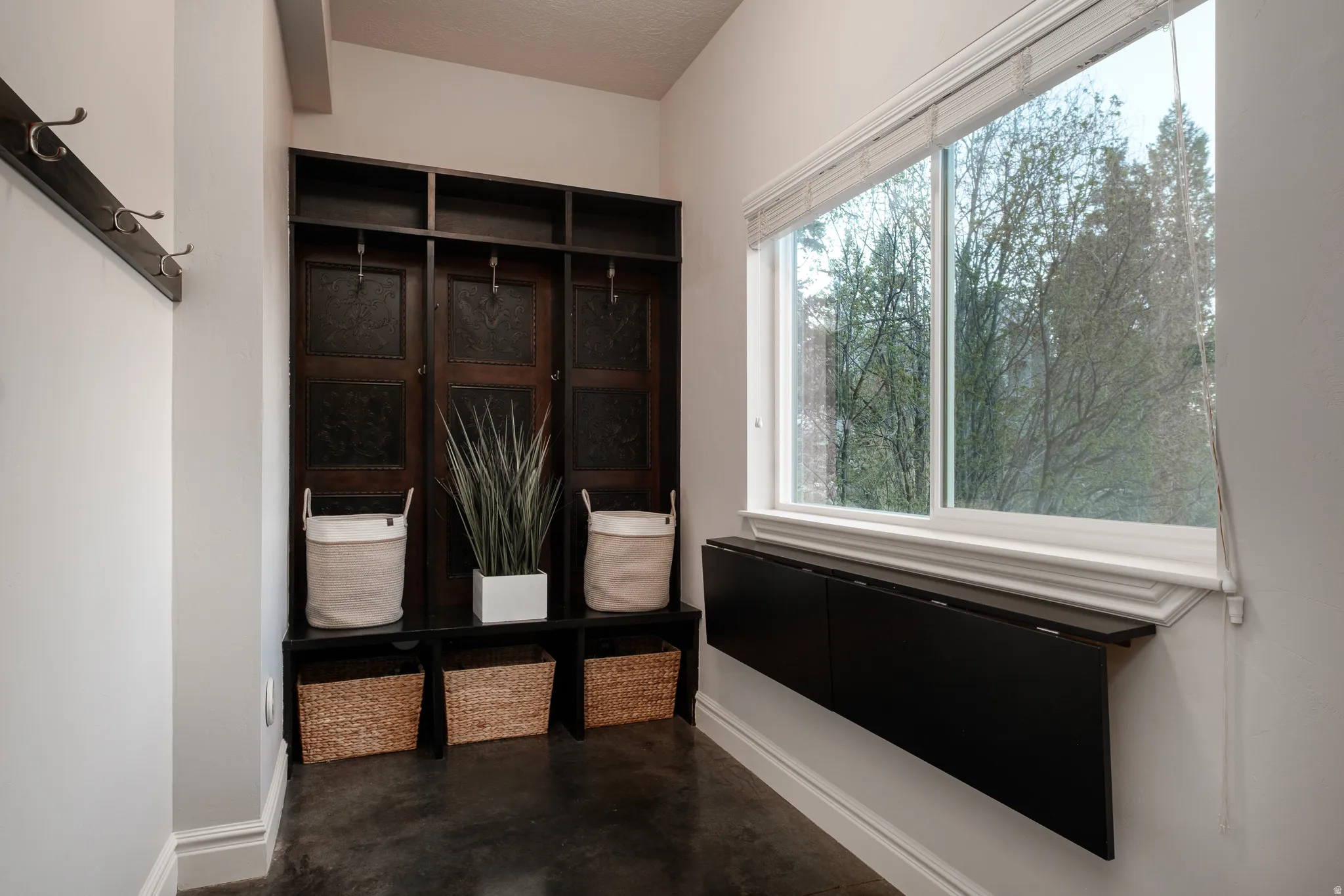 Built-in bench with integrated shelving and storage hooks