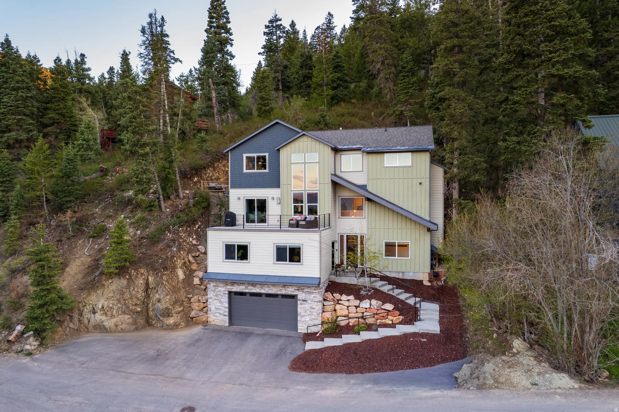 Multi-story residence featuring a contemporary exterior with varying siding textures