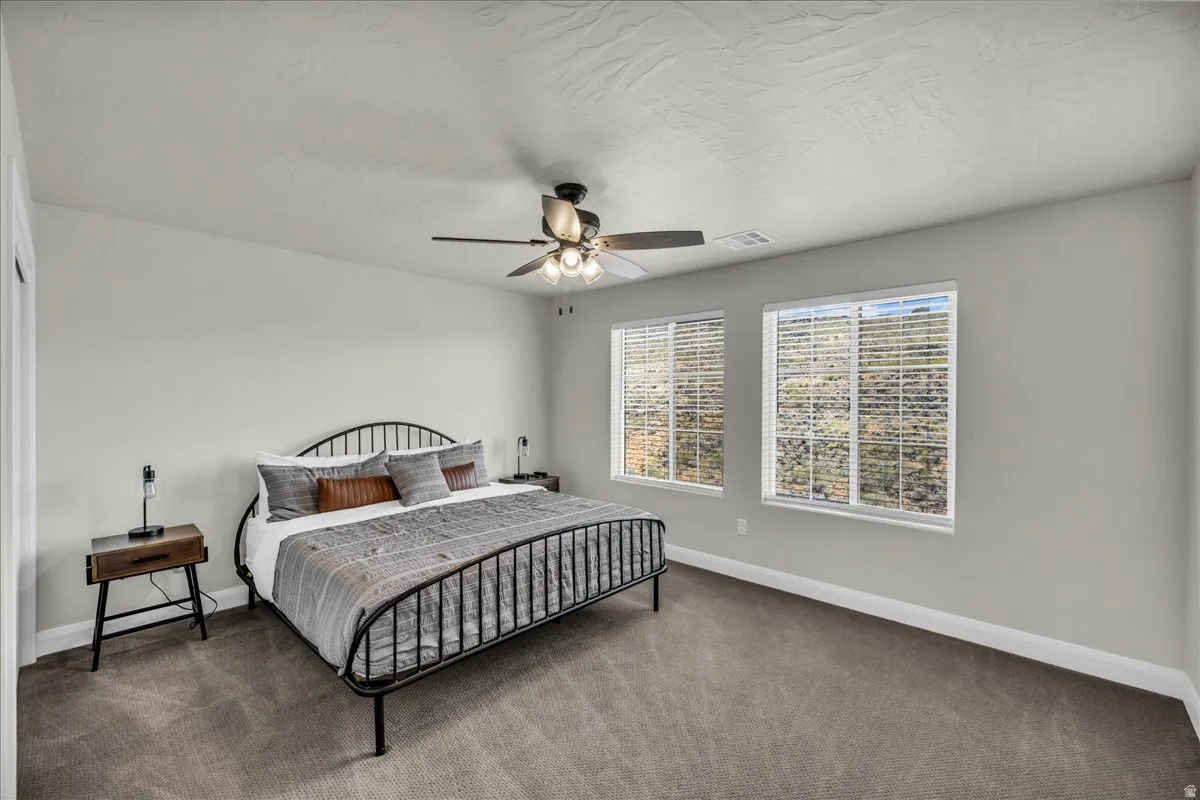 Neutral gray walls with white trim and gray carpeting