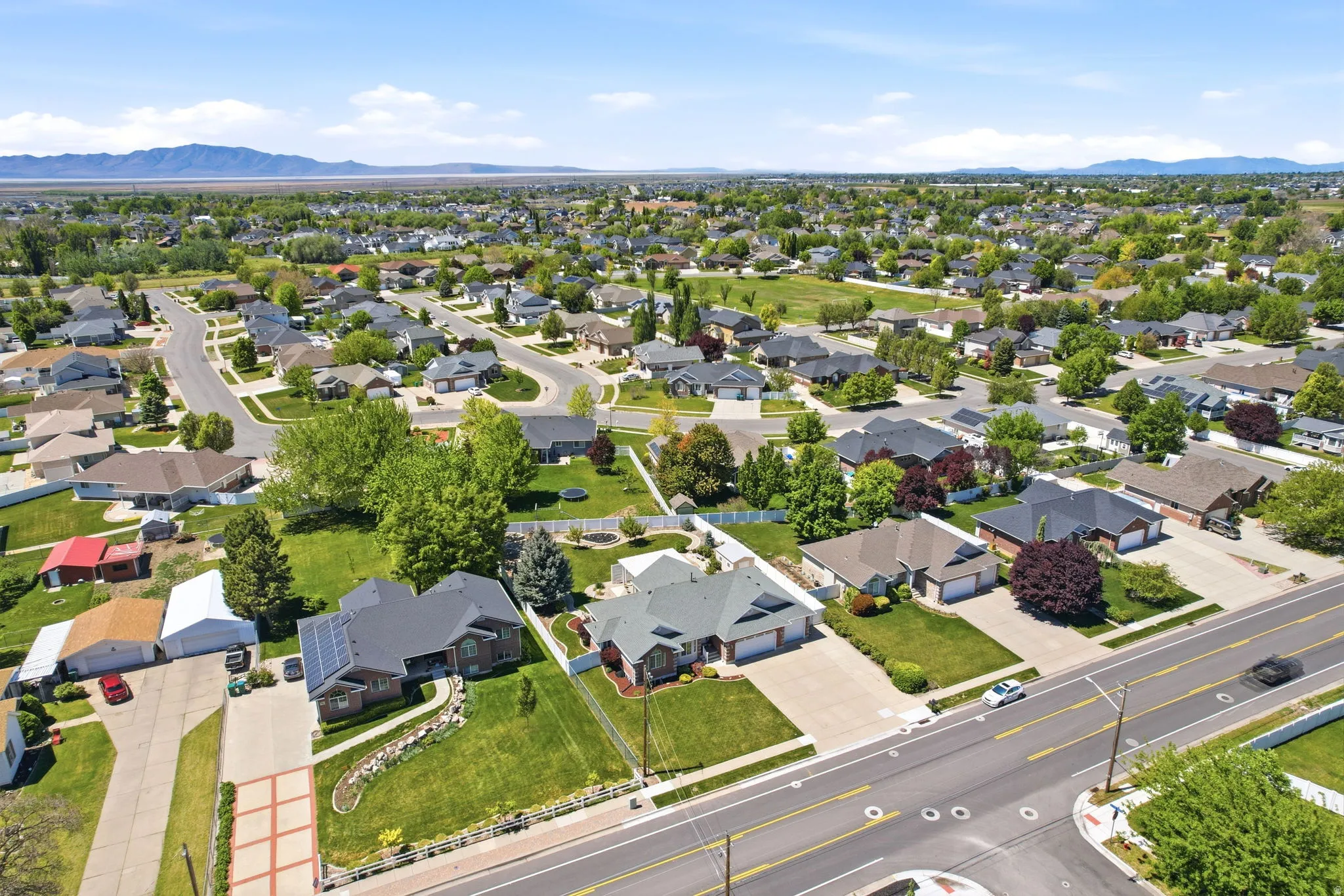Established residential neighborhood featuring mature trees and mountain scenery