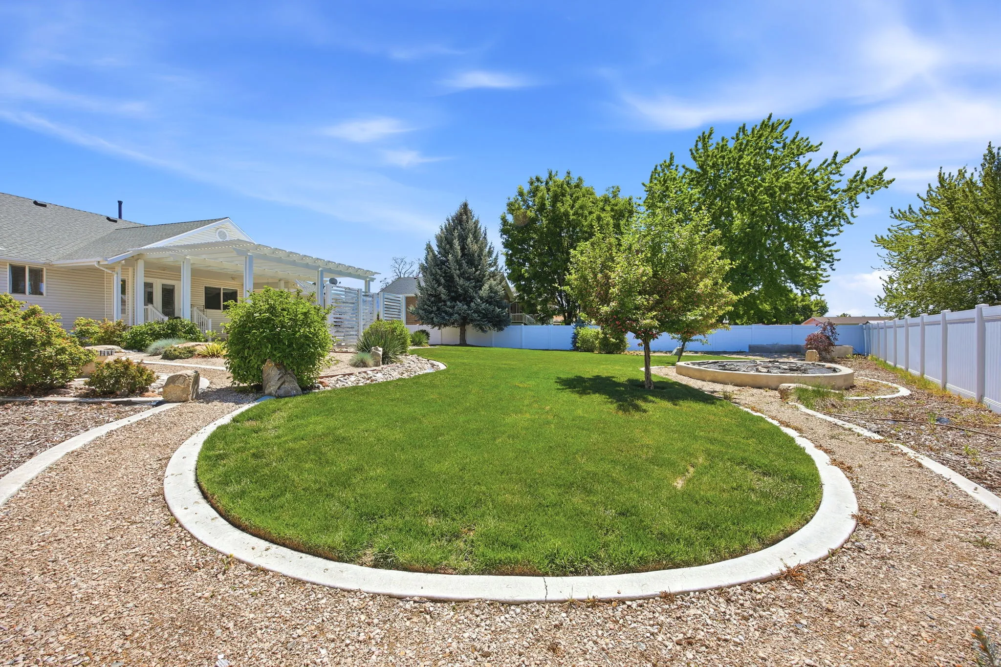 Manicured lawn with concrete-edged gravel pathways